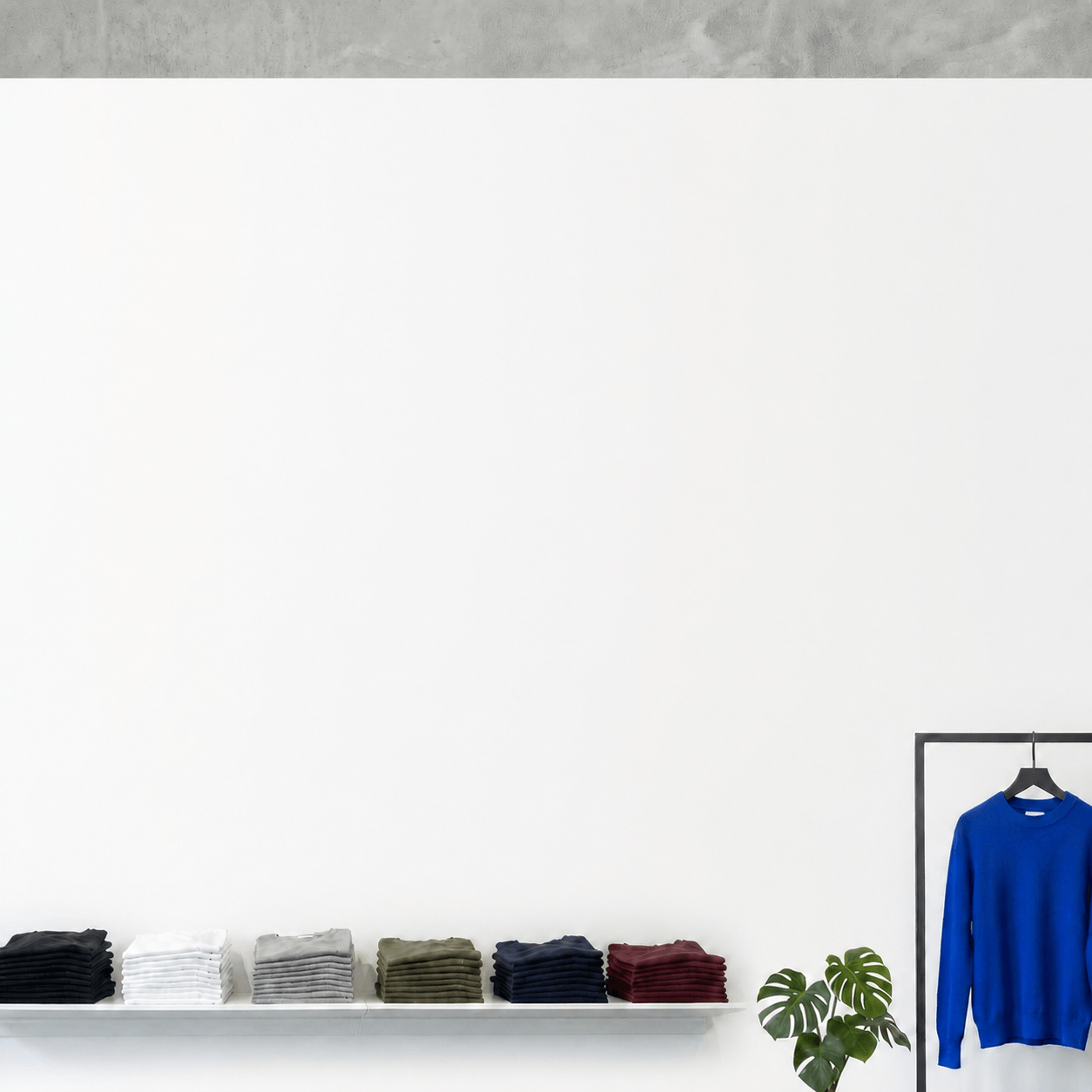 TEESHOPPEN-kläder i en ljus butik